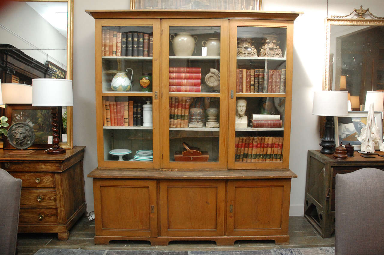1880s Dutch painted bookcase. Cornice top three glass door bookcase with lower cabinet doors raised on bracket feet. Found in a school in the Kladno area of Prague. A great cabinet or display case.