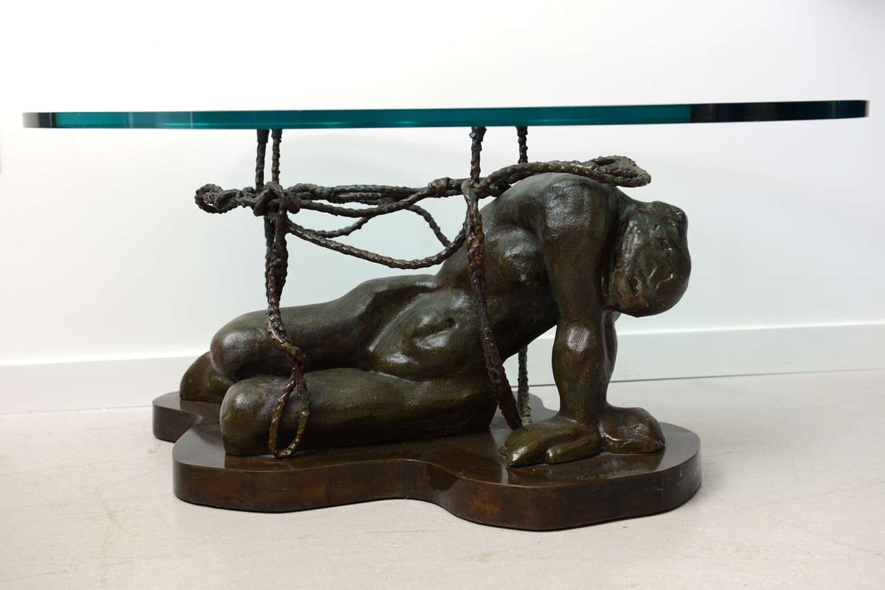 Rare bronze Laverne table depicting a female nude with biomorphic glass top. The table is signed.