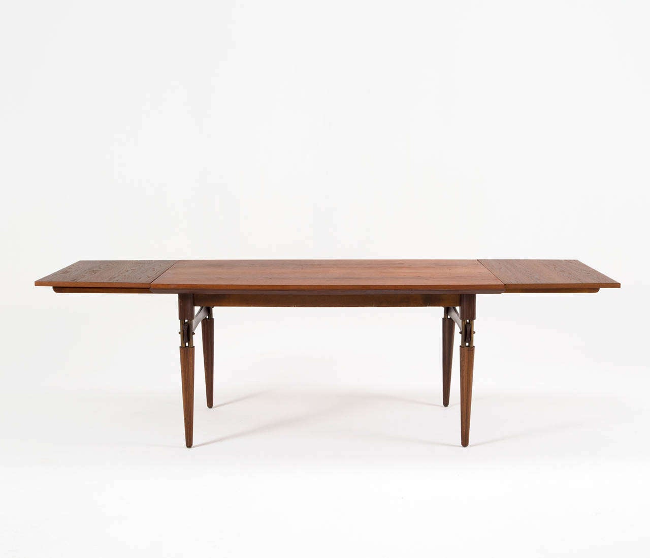 Highly refined Italian 1950's table with 2 extensions.