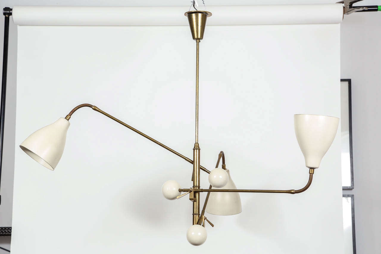 This is a very special piece!  This one of a kind lamp is a highly collectible and sought after brass Arredoluce chandelier from the 1950's.  The light fixture still has it's original wiring and will be a top quality addition to any collection. 
