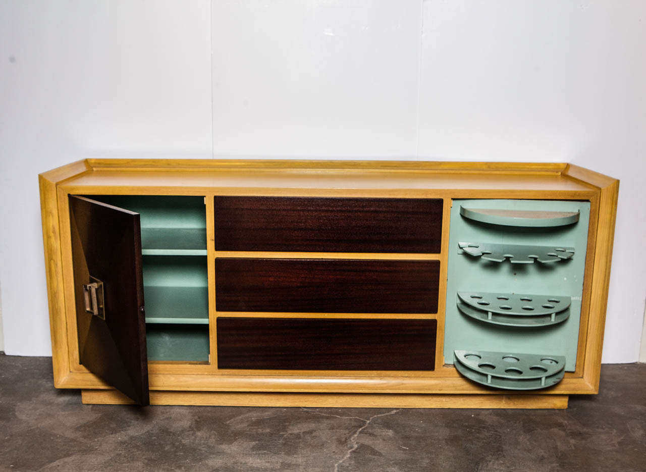 Classic and stunning James Mont credenza in original form. Multi-purpose with cabinet drawers and bar.