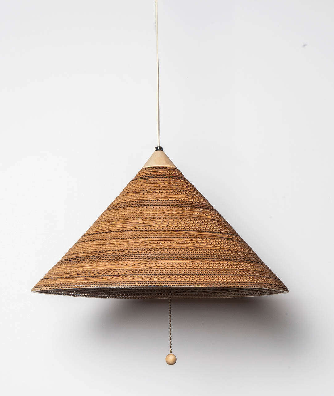 Gregory Van Pelt stacked and laminated cardboard hanging fixture.