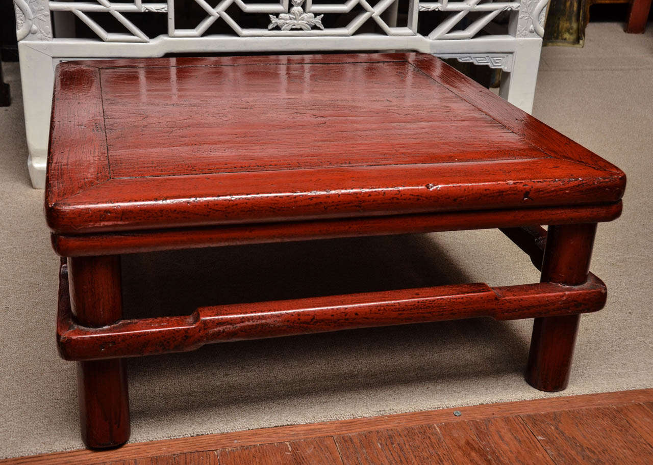 Turn of the century Qing dynasty red lacquered kang table.