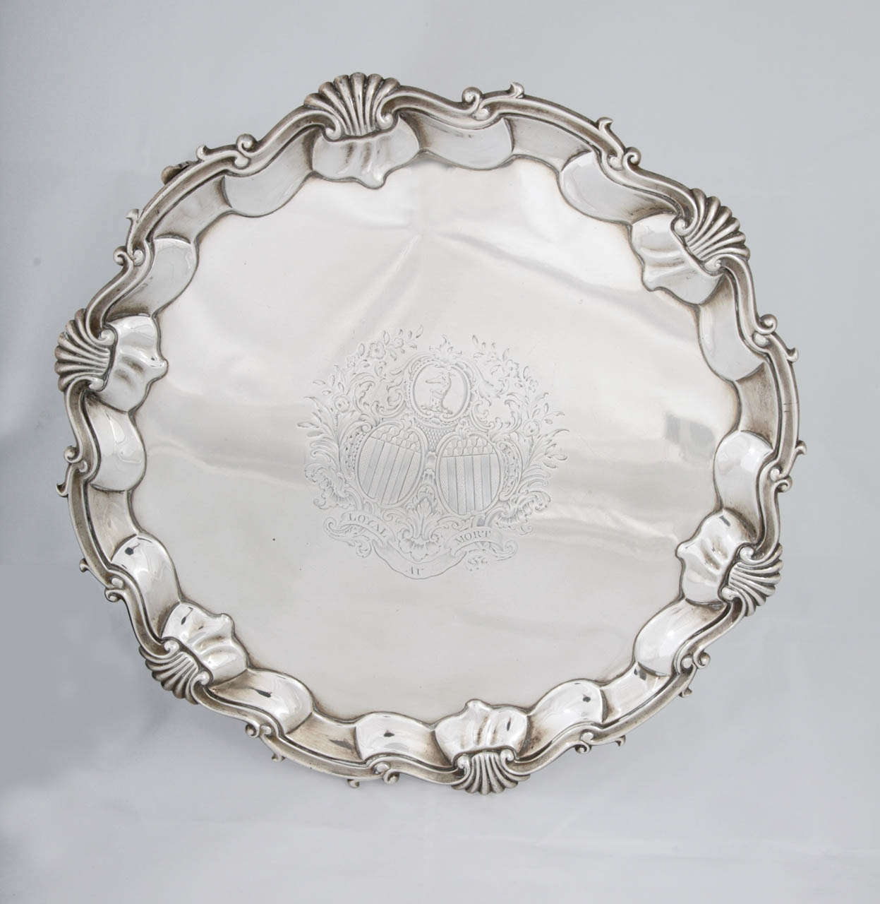 Large silver salver by William Justis. Hallmarked for 1752 with the initials WI for the maker. The coat of arms engraved on the front are for Jonathan Belcher, Govenor-in-Chief of the province of Nova Scotia and later Governor of the Province of New