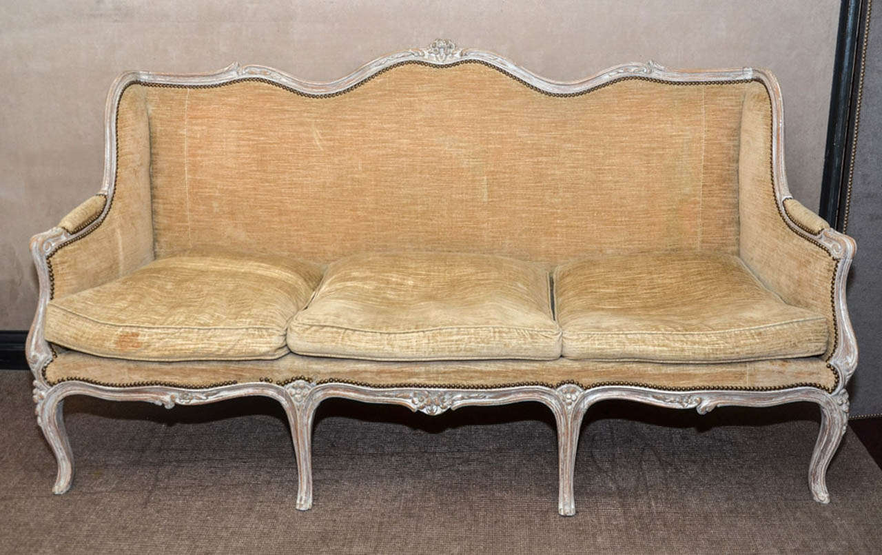 1950's Louis XV three seats sofa. Original worn velvet fabric. New white patina. Good condition. Normal wear consistent with age and use.