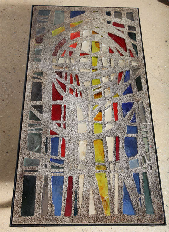 Stained Glass, Cement and Iron Studio Coffee Table created by French artist, and renowned maker of stained glass windows, Gabriel Loire. Featuring a rectangular surface with concrete embedded colored glass inset into a rounded reinforced Dark Iron