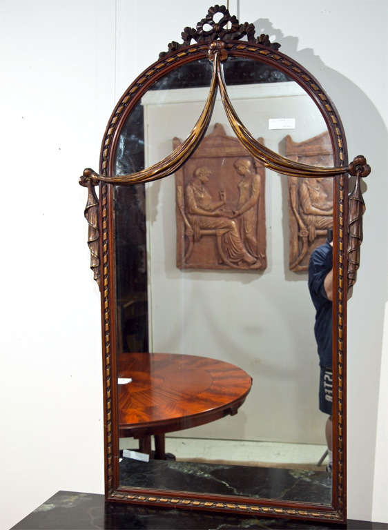 French, Louis XIV style mirror, elegantly carved domed top with ribbon crest, the frame surmounting a domed glass, flanked by beautiful drapery decoration.