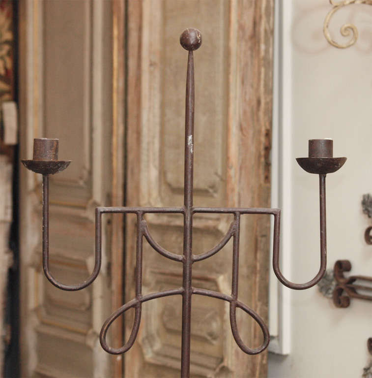 This Italian standing two-arm iron church candlestick has a very pleasing and simple Modern form.