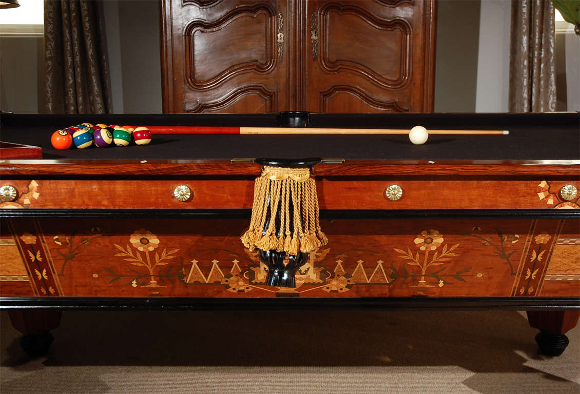 1880's Brunswick Pool Table with finely inlaid exotic wood and original Brunswick Brass Plaque. Mint condition.