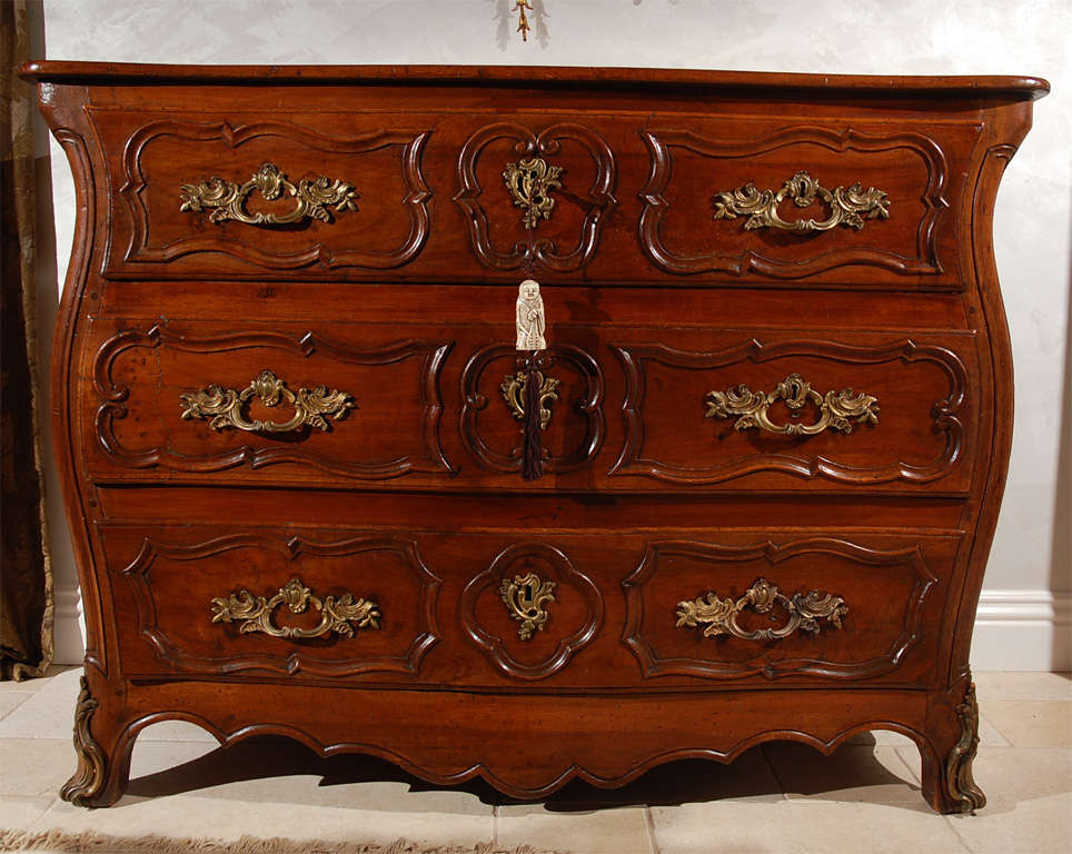 18th century French Walnut Regence Three-Drawer Commode with Bronze Mountings.  Key included. From the Estate of Hal Wallis.