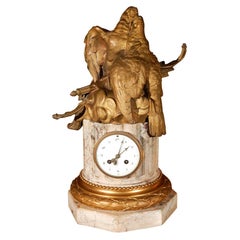 Reloj francés del siglo XIX de bronce dorado y mármol (firmado)