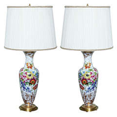 A stunning pair of floral opaline glass vases lamps by Baccarat.