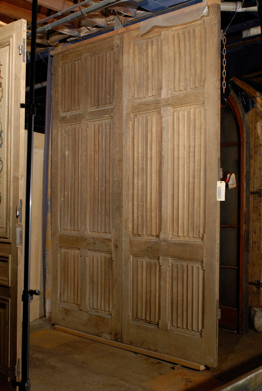 Pair of  rare 19th C. French oak carriage house doors with carved linenfold panels.