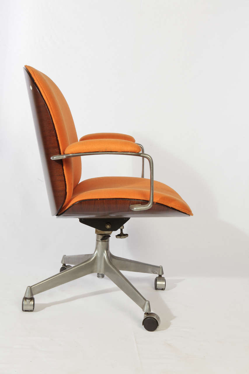 pair of Ico Parisi armchair from Mim with weels ; rosewood, aluminium, orange cotton; marked on the bottom MIM 
Exhibition: COPPIE CELEBRI  in Parma  2008 :bibliografy: COPPIE CELEBRI .Sitcom Editore 2008 pag 138,139