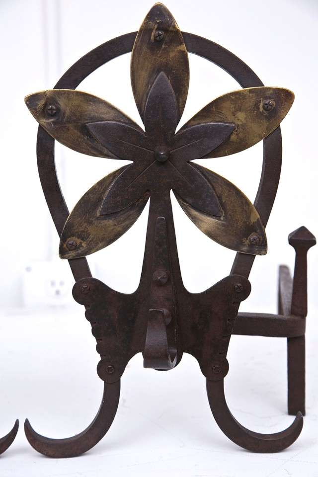 Pair of Louis Majorelle wrought iron and brass andirons, double open flower design.