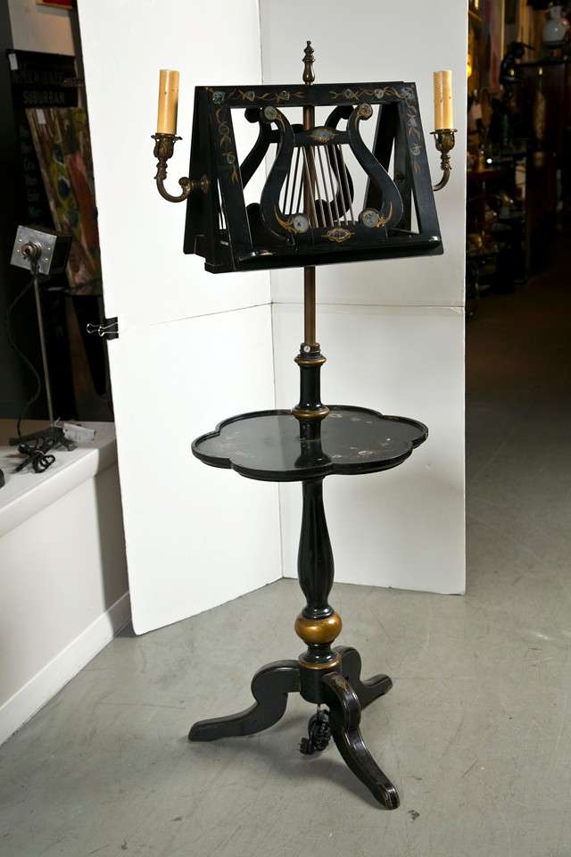 Black lacquered music stand with mother of pearl inlay.