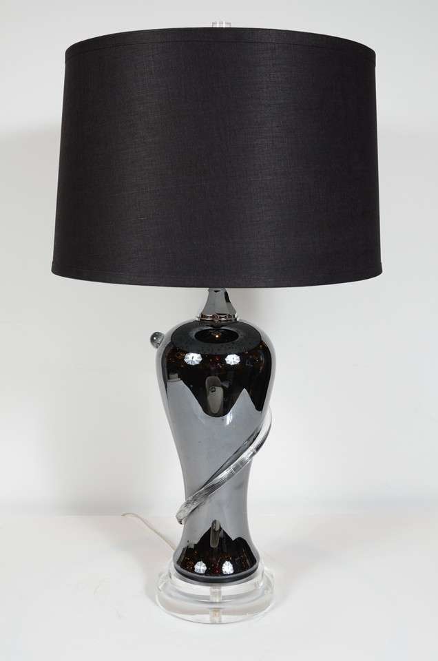 Modernist black hand blown glass urn shaped lamp with a raised swirl pattern in translucent glass, a tiered lucite base and chrome fittings throughout. It has been fitted with a new custom shade and has been newly re-wired to American standards.