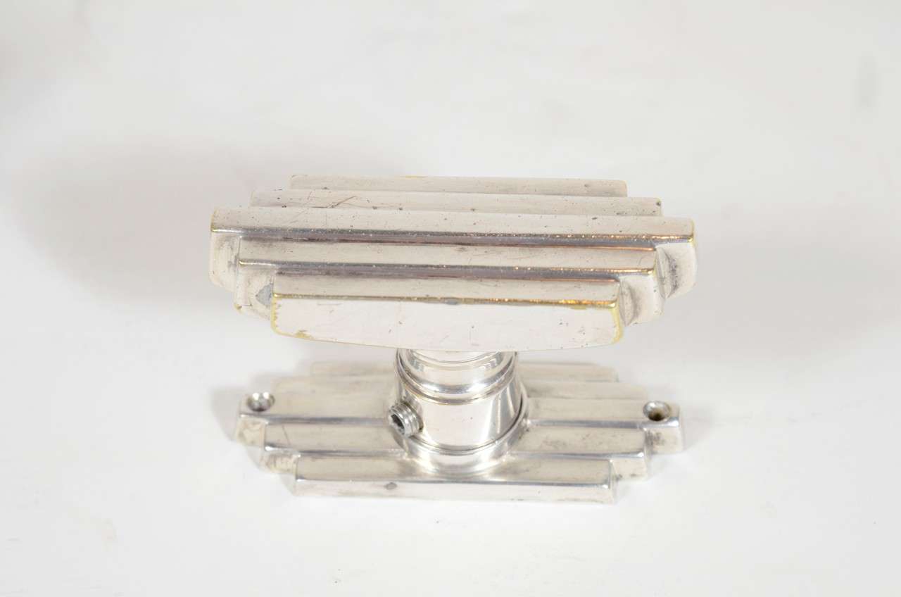 This gorgeous nickel Art Deco door pull and base plate has a distinctive skyscraper design.