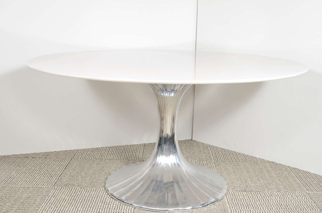 This beautiful table has a large slimline granite top on a fluted metal pedestal base. 