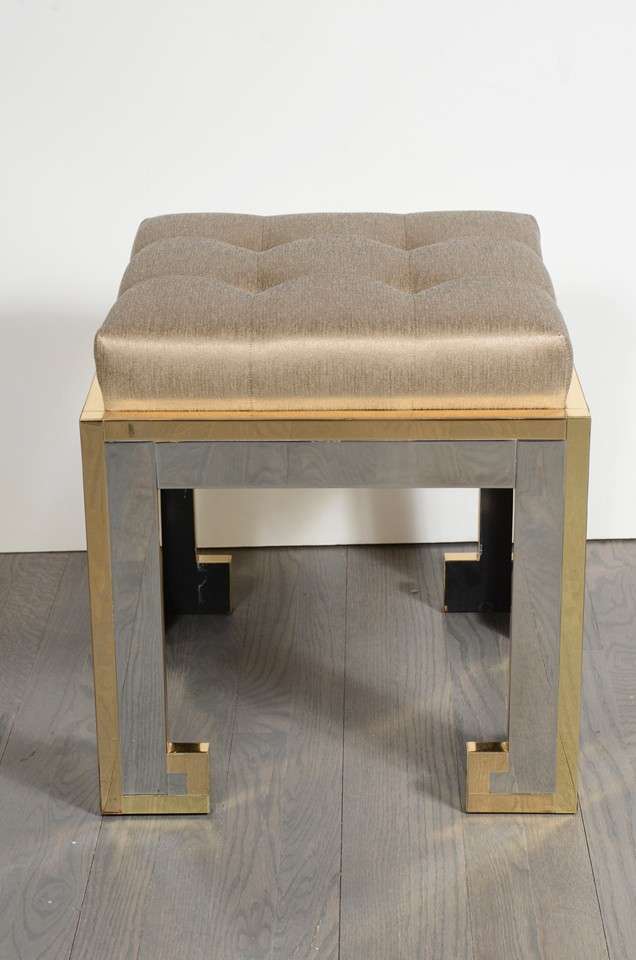This pair of Greek Key stools are in polished nickel with brass trim, new metallic bronze sharkskin upholstery with button biscuit  tufting detail.