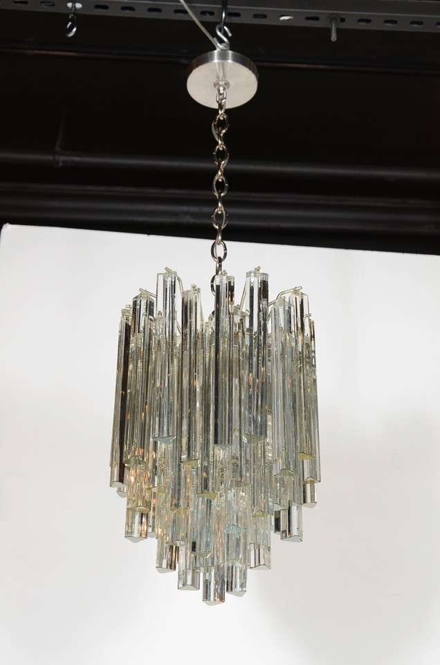Spectacular Chandlier of Triedre Crystals in a cascading design on brass fittings. Designed by Camer and has been completely re-wired and fitted with 4 lights and can be adjusted in height.