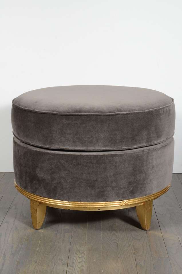 Classic ottoman newly upholstered in grey mohair. Tapered legs and a gilt ribbed detail.Newly reupholstered in gorgeous grey velvet.Has a matching chair and sofa that is sold separately.