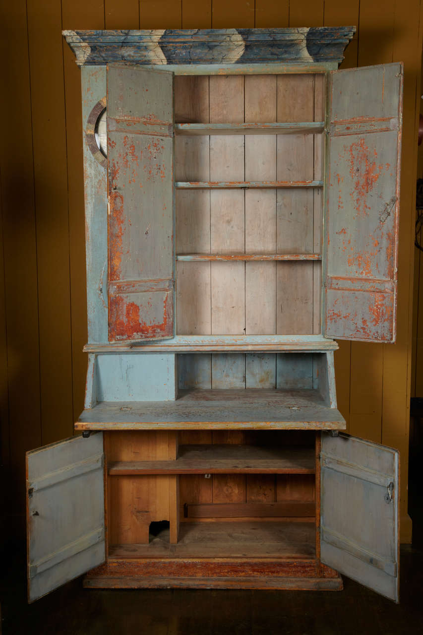 VERY UNUSUAL PIECE OF ASYMETRICAL PIECE OF FURNITURE FROM NORTH OF SWEDEN. PAINTED IN TWO DIFFERENT COLORS.
PATINA OF ORIGIN WITH SKY IMITATION ON THE CORNICHE
AND BEAUTIFULL SWEDISH RED ON THE BASE. 
ORIGINAL HAND FORGED LOCKERS AND KNOBS.