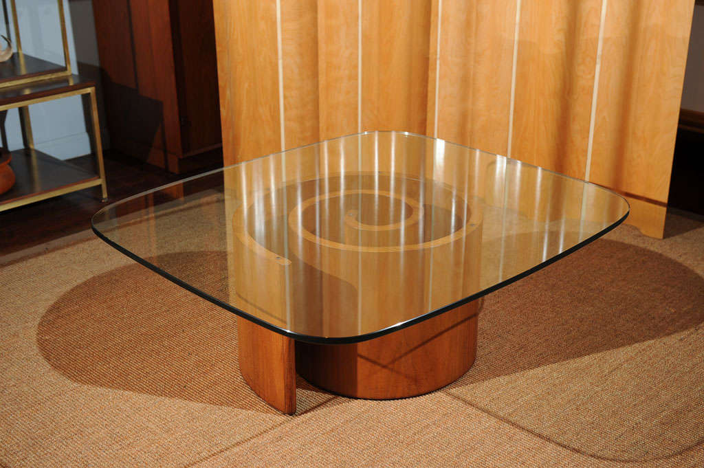 Sculptural walnut veneer snail table with excellent original condition tempered glass top.