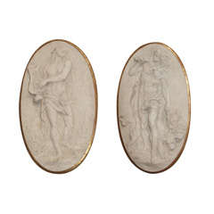 A Pair of Oval Marbelized Terra Cotta Medallions