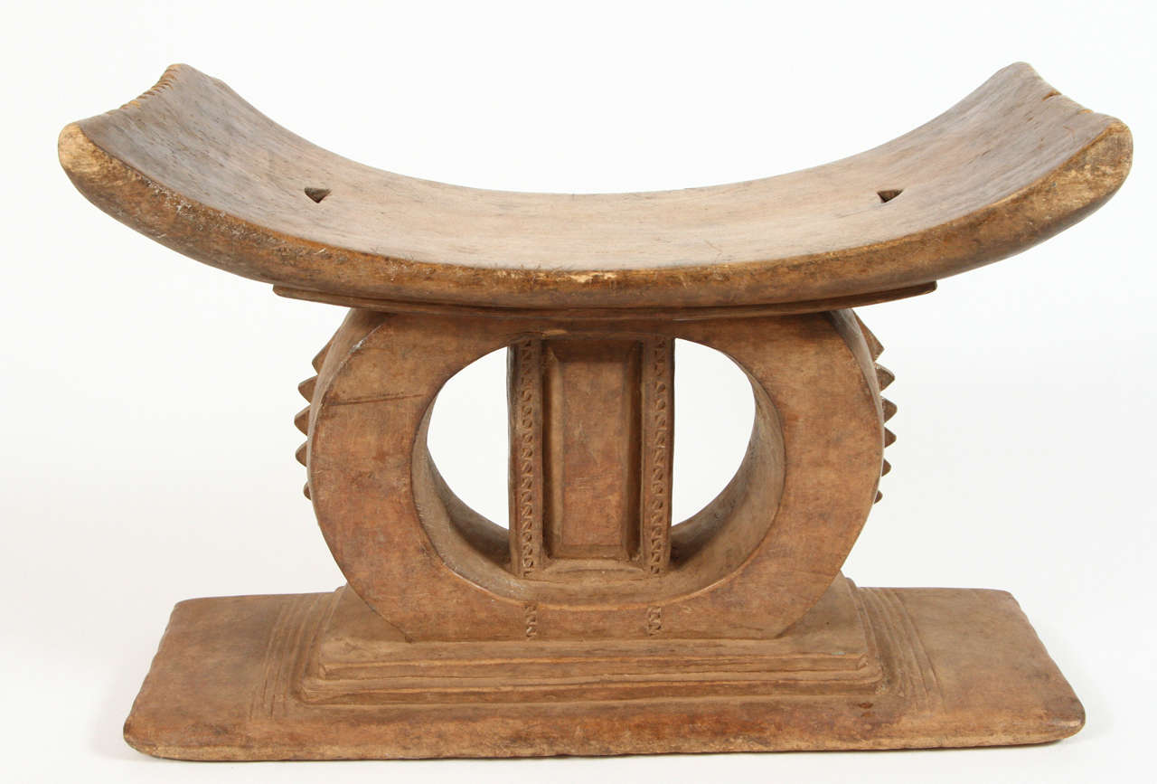 Elaborate hand-carved African Ashanti Stool. Made in Ghana, circa early 20th century.