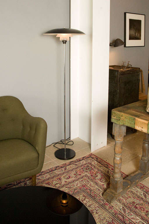 an amazing pair of poul henningsen floor lamps with large black enameled top shade , in original condition.
