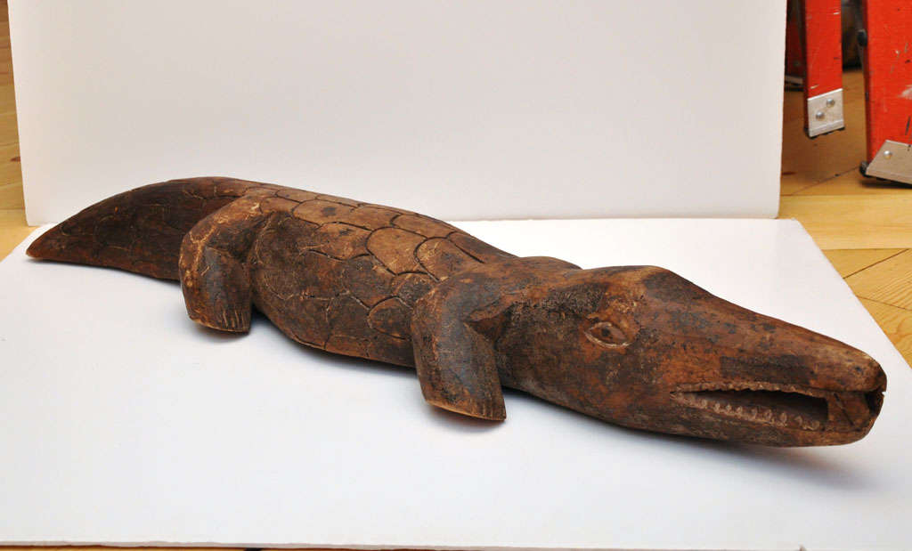 Carved animal figures are common in African sculpture.  the figure is created as a protective object said to embody the power of the animal which inspired it.  This crocodile fetish is used by fishing people of the Bobo tribe of Burkina Fasso.  Kept