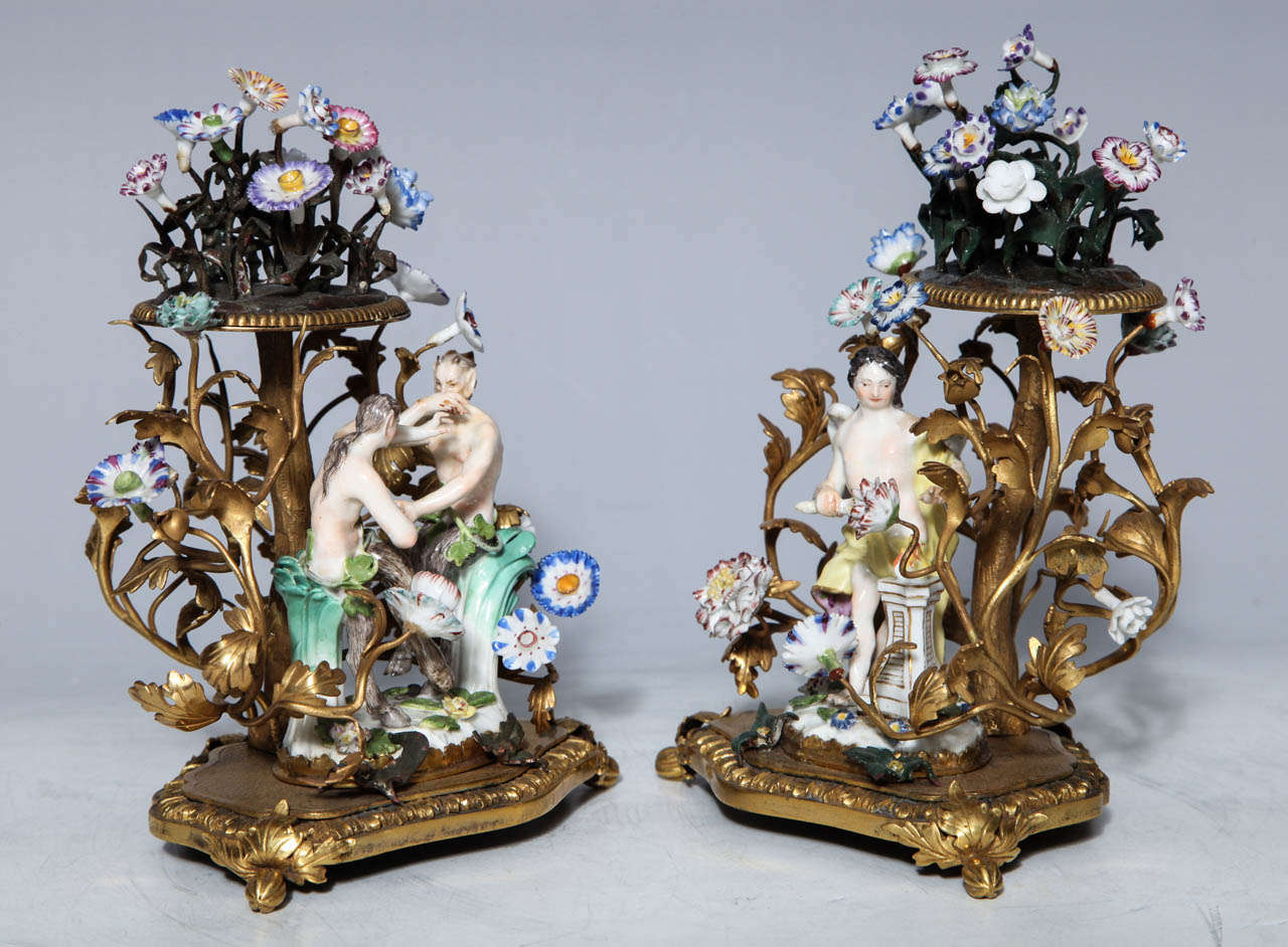 This pair of Meissen groups portray scenes of playful lovers in bowers of flowers embellished with mercury gilded bronze. The bowers are crowned with additional nosegays of porcelain flowers. Porcelain was so admired and treasured in the 18th