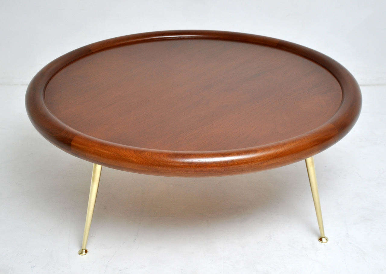 Round cocktail table with solid brass legs by TH Robsjohn-Gibbings.  Beautifully restored and refinished.