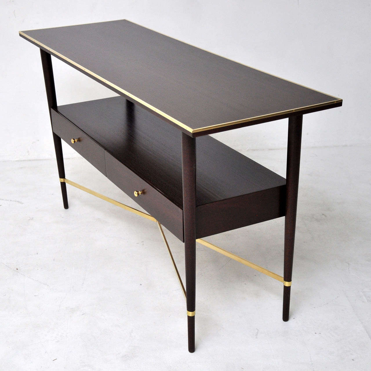 Paul McCobb Connoisseur Collection console table for H. Sacks. Fully restored in espresso finish. Brass X-base frame with brass details.