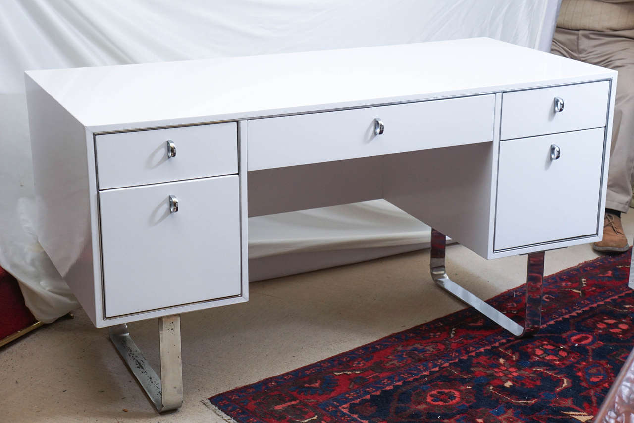 A stunning White Lacqured desk with chrome legs by West Michigan Furniture Company