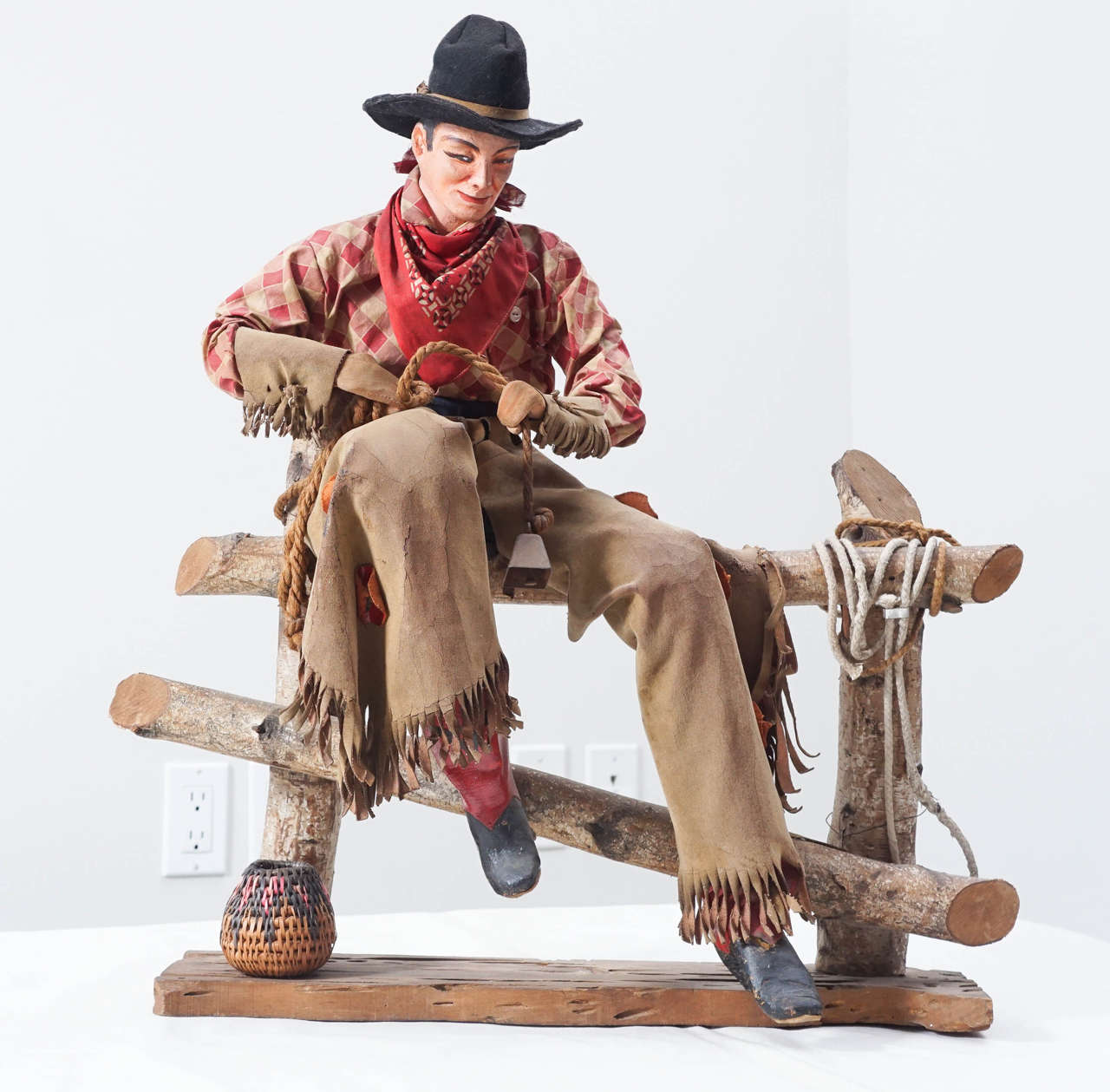 The cowboy sculpture from the 1940s may have been a display piece for a clothing store selling western wear. Now he is a great piece of art.