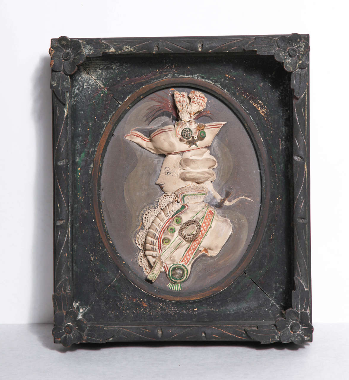 Whimsical signed assemblage by American artist and designer Tony Duquette (1914–1999). Unusual found materials employed including plaster-dipped doilies, ribbon, and rope and enclosed by a period frame Duquette ebonized and embellished with glitter.