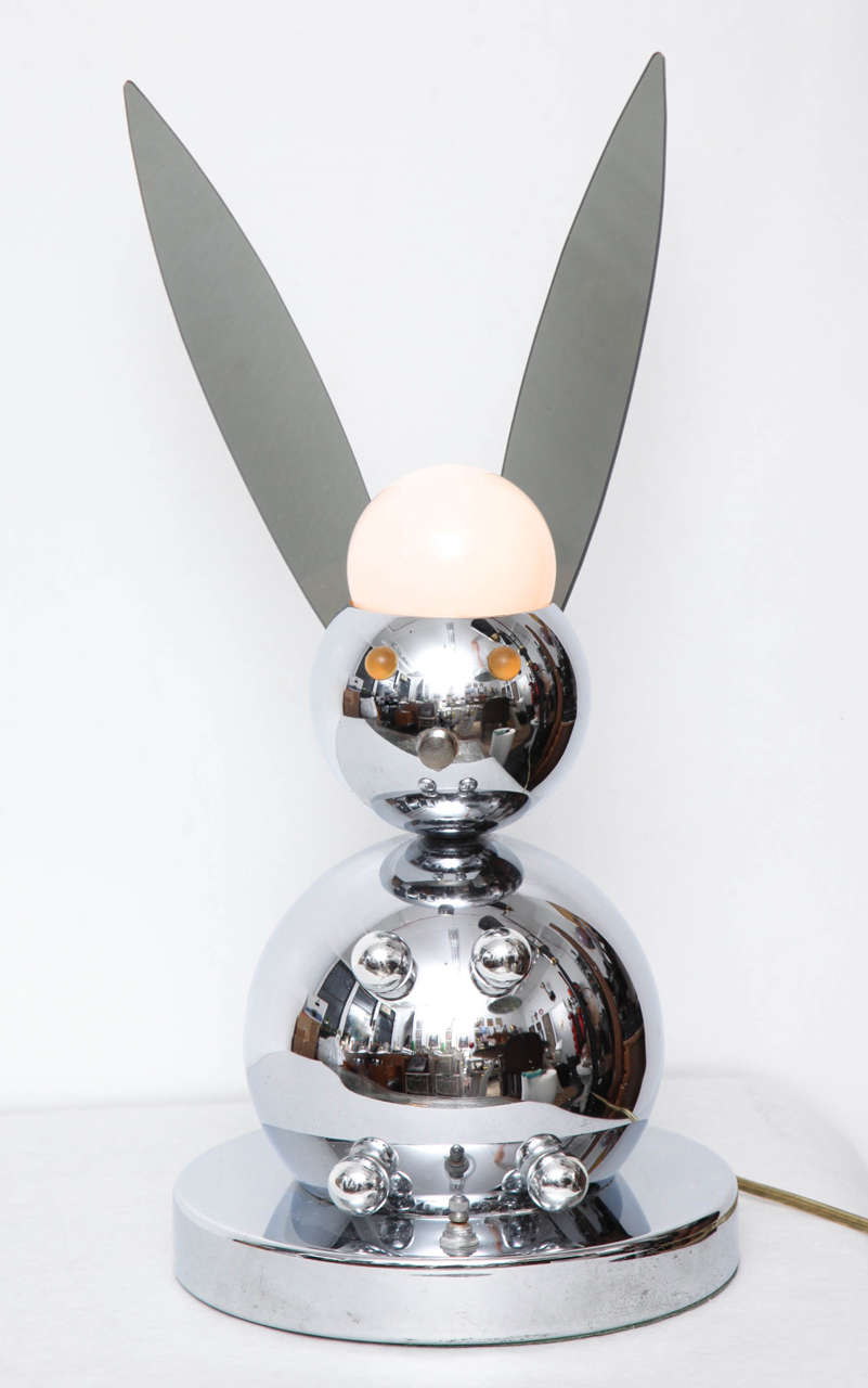 Lamp features a white globe enclosing a bulb on top of head and eyes that glow when switch on base activated. With plexiglass ears. The bunny model is one of the scarcest made by Torino.

With original Torino label on base.