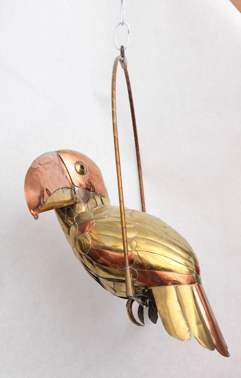 Whimsical brass and copper toucan sculpture by Mexican artist Sergio Bustamante.