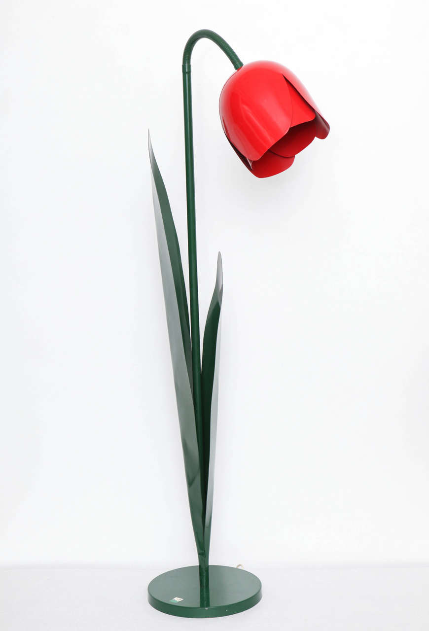 Fabulous tulip floor lamp still bearing original Bliss maker's label. Deep green enameled metal base with flexible stem terminating in the red enameled flower head. Cord with foot switch. Height with stem bent as seen in photo is 58