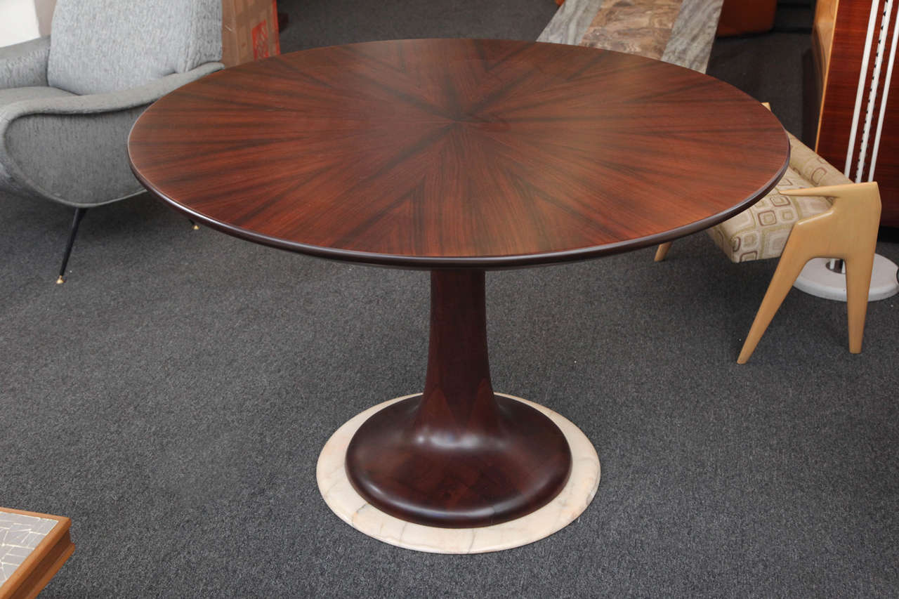 Elegant dining table in rosewood and walnut, base in marble, designed by Paolo Buffa made in Milan, 1955. Never saw a form like this, beautiful way they matched the rosewood on top.