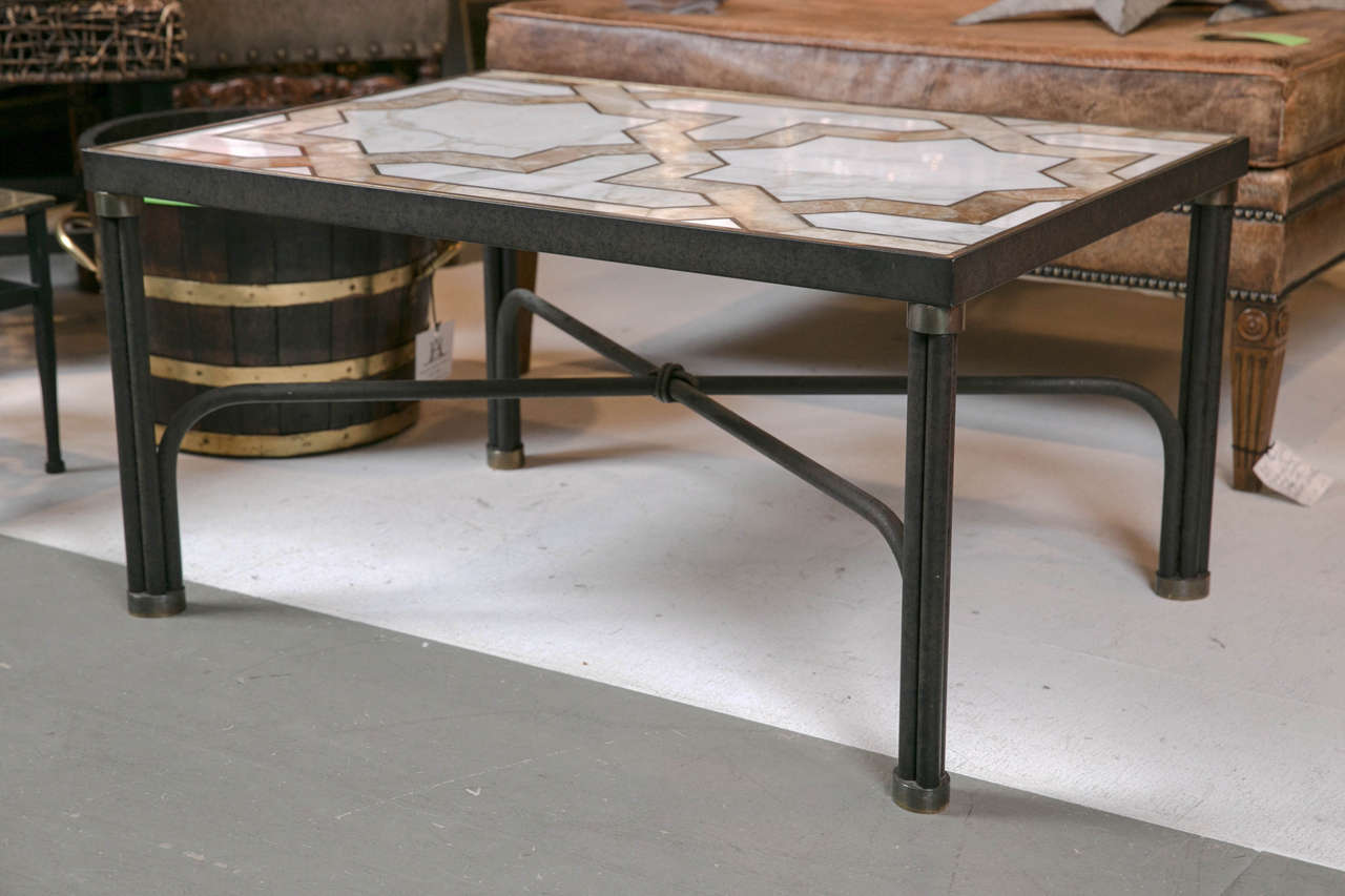 A wonderful inlaid marble coffee table, with a solid bronze base circa 1960's.