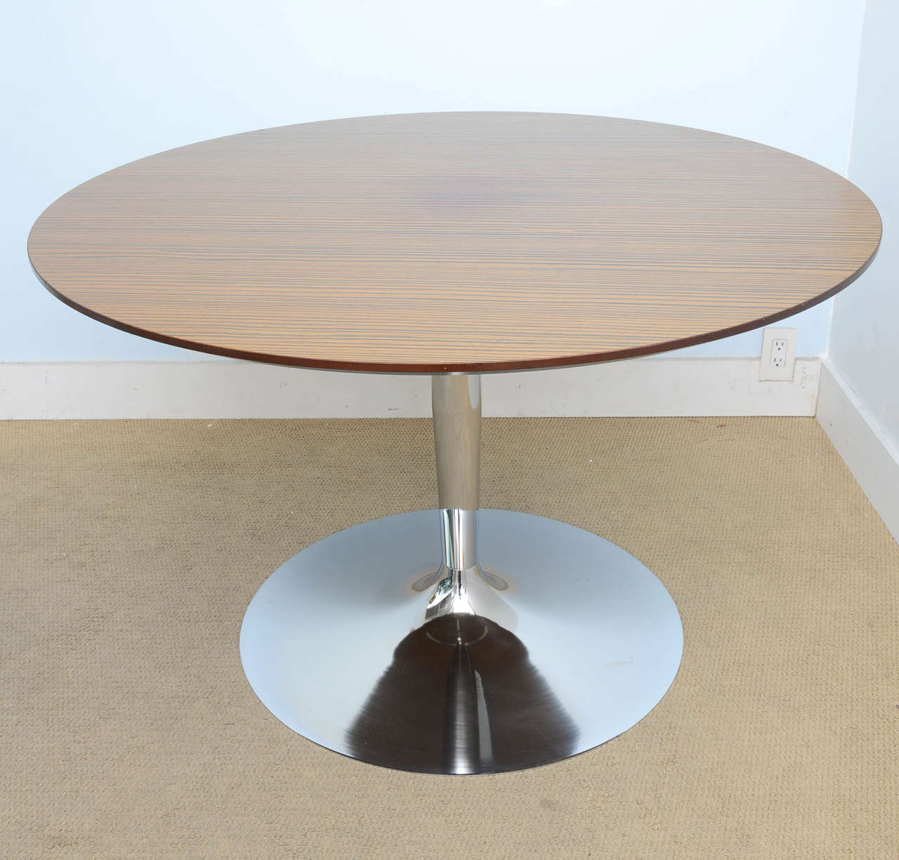 This table was manufactured in Italy. It's in excellent condition. Chrome is in excellent condition and the beautiful veneer top is also in great condition.
