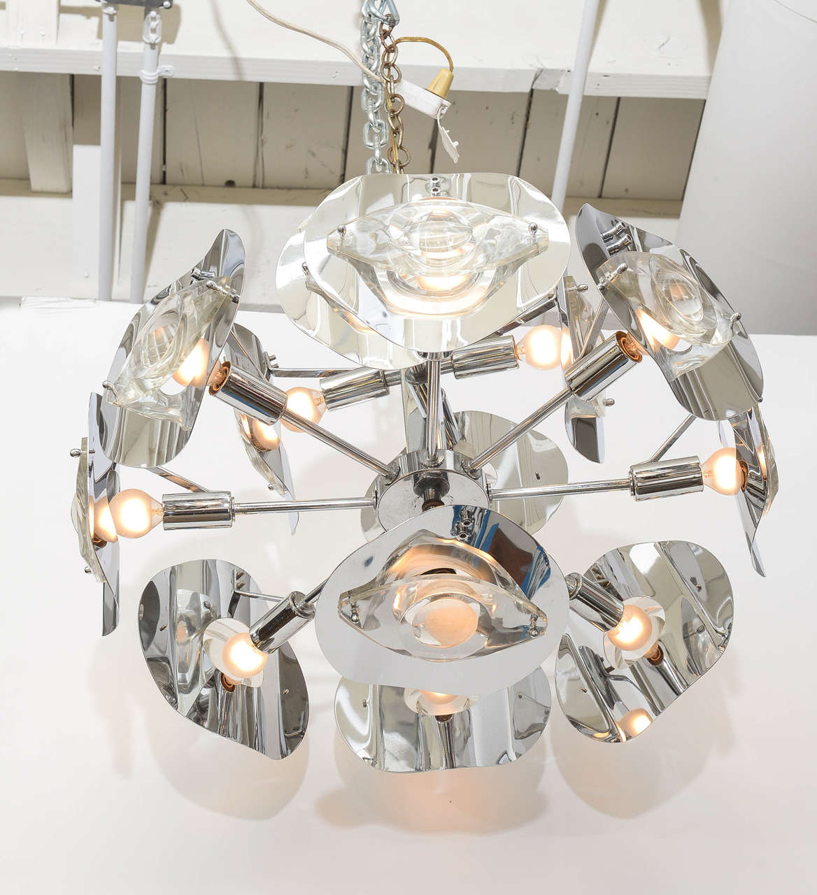 Beautiful Lens chandelier by Italian Designer / Lighting Manufacturer Gaetano Sciolari . This amazing piece dates back to the 1970,s . It's an incredible example of modern lighting of this era . The piece is in very good condition with no damage