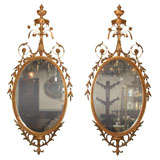 Pair Adams style English oval mirrors