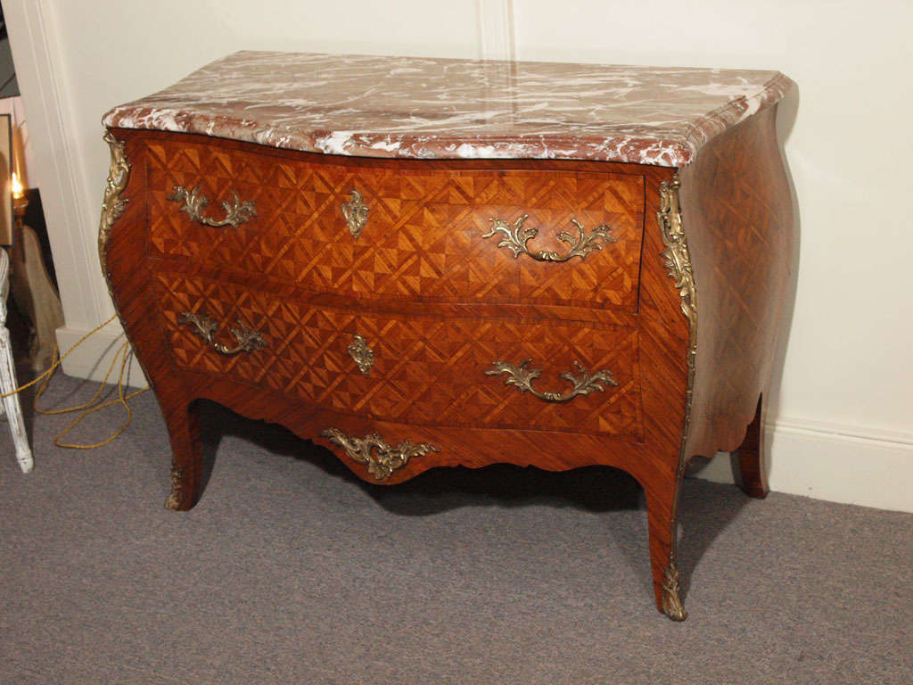 Antique French bombe parquetry commode.