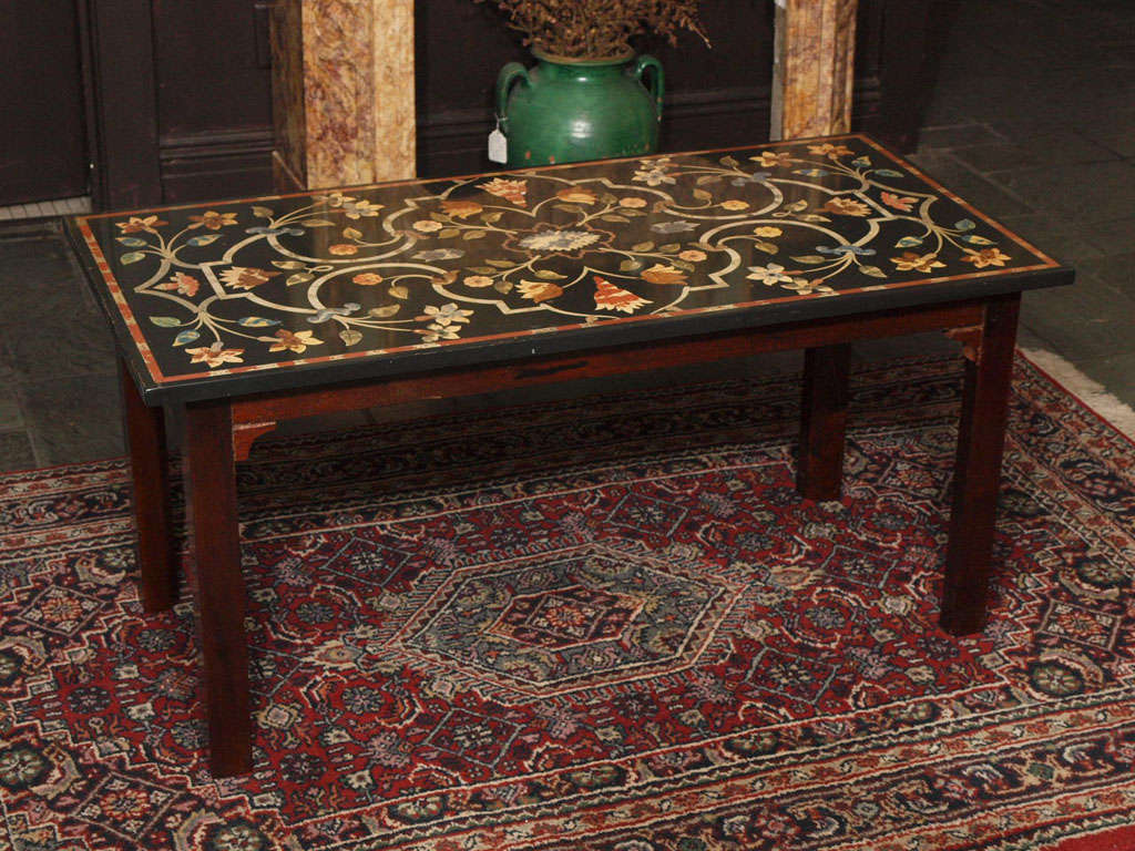 Antique Italian petra dura style marble top coffee table on mahogany base.