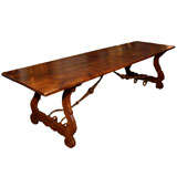 Antique Italian walnut long table with original stretcher base