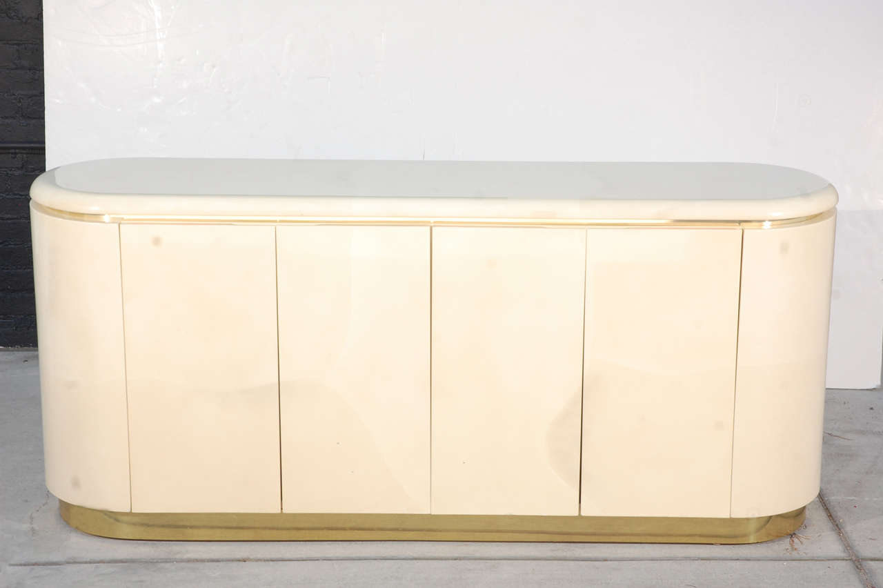 1980s Karl Springer style faux goatskin wrapped credenza with brass accents